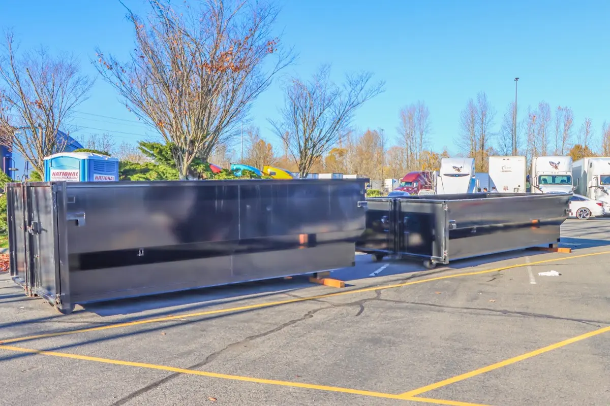 Professional dumpster rental service with roll-off container on residential driveway in Chatham